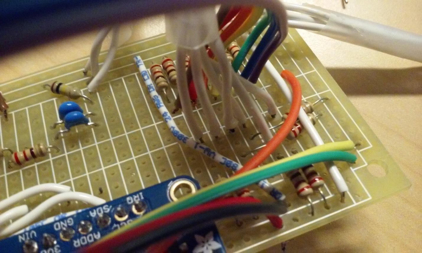 The digital pins (in rainbow) and the 3-way switch (in white).